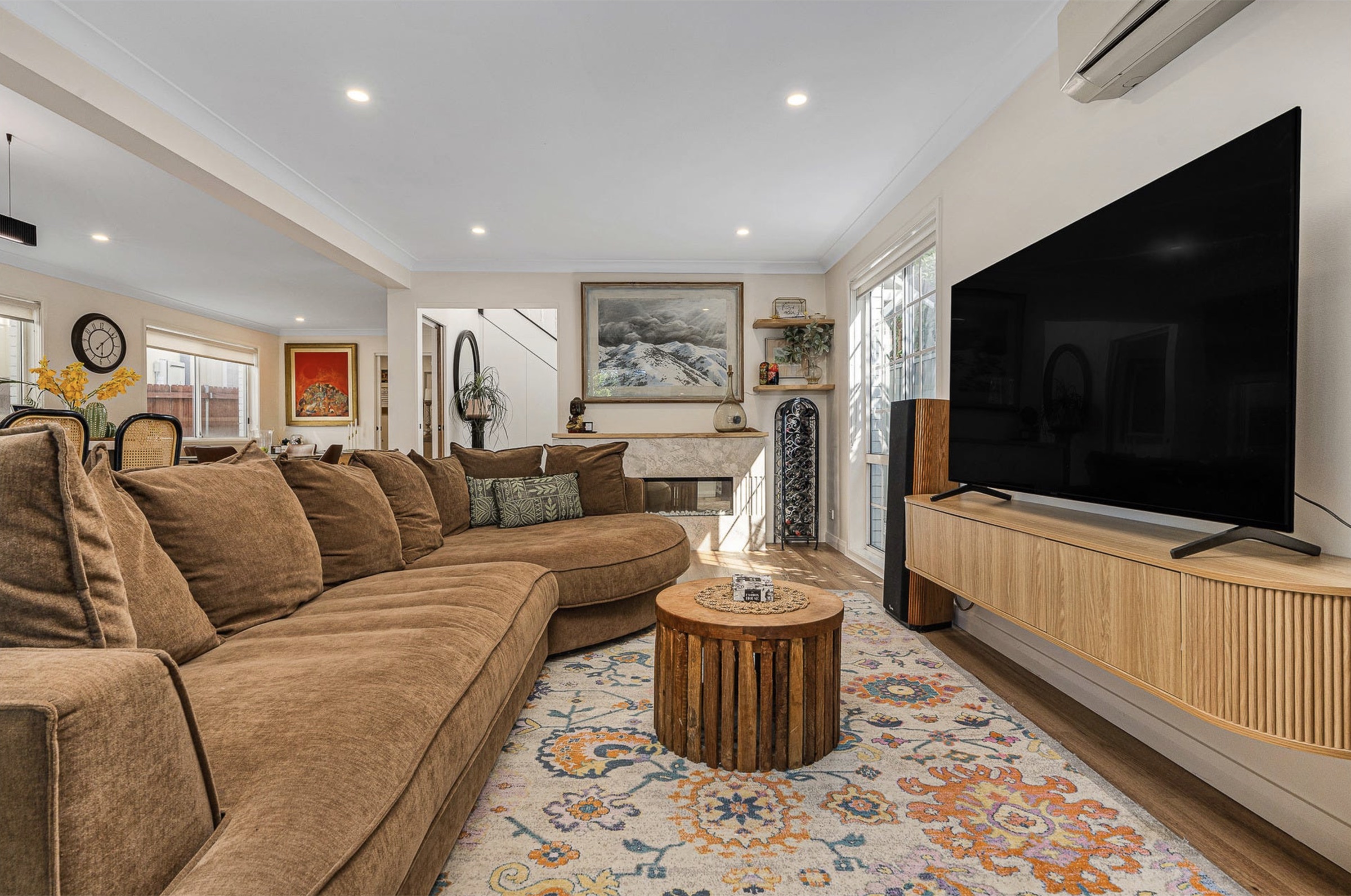 Living room with stone fireplace surround and mantel
